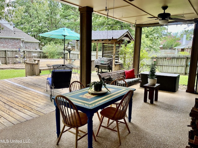 1024 Riverchase N Dr, Brandon, MS 39047 - fenced backyard with ceiling fan, outdoor dining space, and a deck