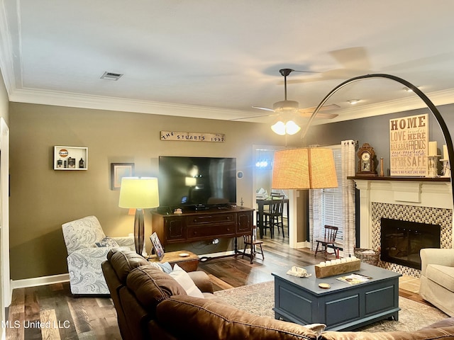 1024 Riverchase N Dr, Brandon, MS 39047 - living room featuring ornamental molding, wood finished floors, a fireplace, and ceiling fan