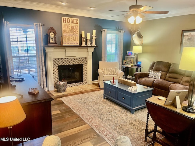1024 Riverchase N Dr, Brandon, MS 39047 - living room with a ceiling fan, ornamental molding, light wood-type flooring, and a tile fireplace