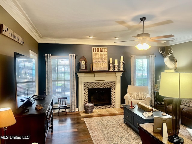 1024 Riverchase N Dr, Brandon, MS 39047 - living room featuring plenty of natural light, a ceiling fan, a tile fireplace, wood finished floors, and crown molding