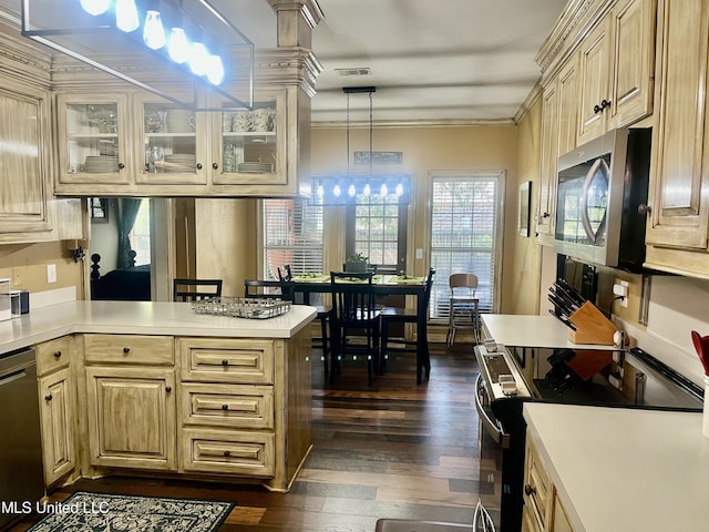 1024 Riverchase N Dr, Brandon, MS 39047 - kitchen with appliances with stainless steel finishes, light countertops, dark wood-style flooring, glass insert cabinets, and ornamental molding