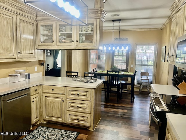 1024 Riverchase N Dr, Brandon, MS 39047 - kitchen featuring stainless steel appliances, light countertops, dark wood-type flooring, glass insert cabinets, and ornamental molding