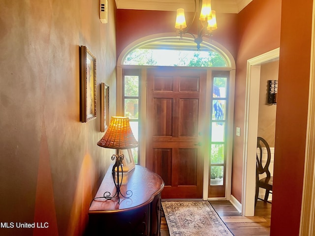 1024 Riverchase N Dr, Brandon, MS 39047 - foyer featuring a chandelier, wood finished floors, and ornamental molding