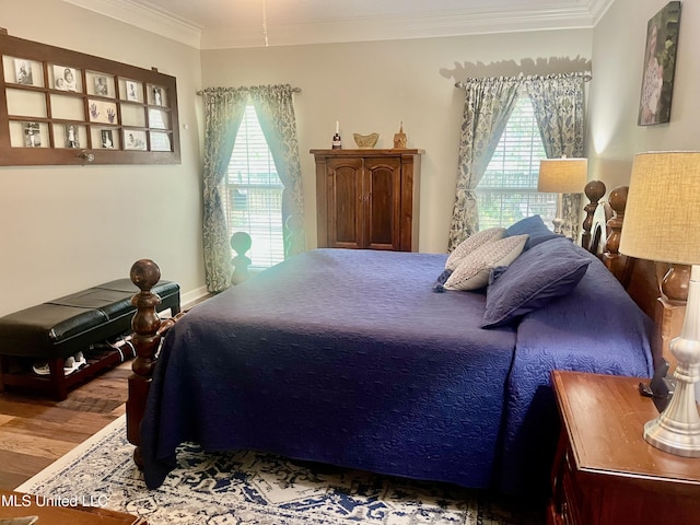 1024 Riverchase N Dr, Brandon, MS 39047 - bedroom with multiple windows, wood finished floors, and ornamental molding
