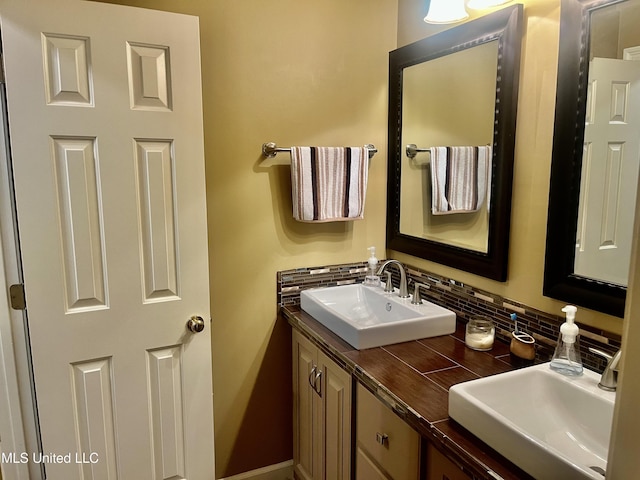 1024 Riverchase N Dr, Brandon, MS 39047 - bathroom with decorative backsplash and double vanity