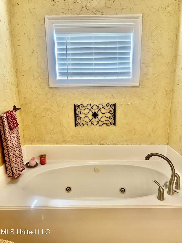 1024 Riverchase N Dr, Brandon, MS 39047 - bathroom with a whirlpool tub