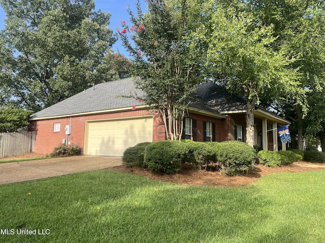 1024 Riverchase N Dr, Brandon, MS 39047 - view of front facade with a garage, concrete driveway, brick siding, and a shingled roof