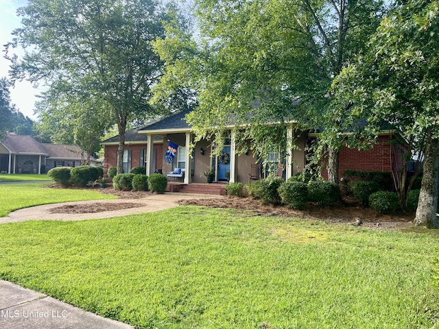 1024 Riverchase N Dr, Brandon, MS 39047 - view of front of house featuring a porch, a front yard, and brick siding