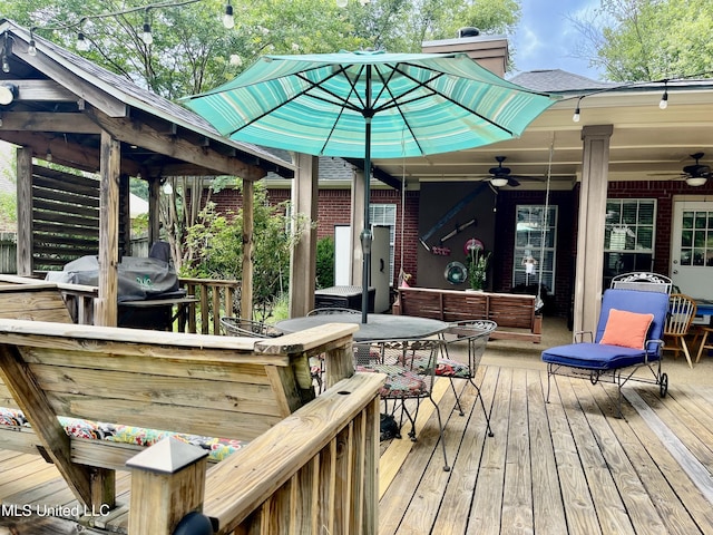 1024 Riverchase N Dr, Brandon, MS 39047 - deck featuring a ceiling fan, a grill, and outdoor dining space