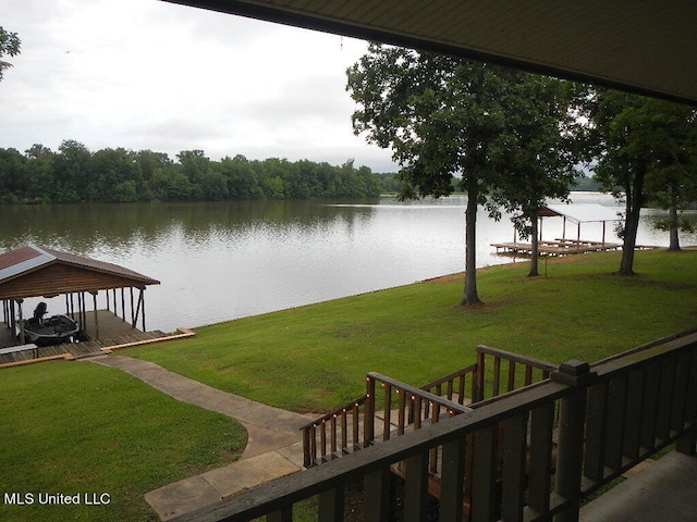 exterior space featuring a dock and a water view