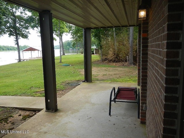 view of patio with a water view