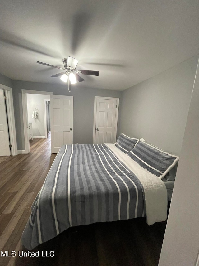 bedroom featuring hardwood / wood-style floors and ceiling fan