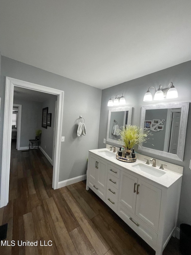 bathroom with vanity and hardwood / wood-style flooring