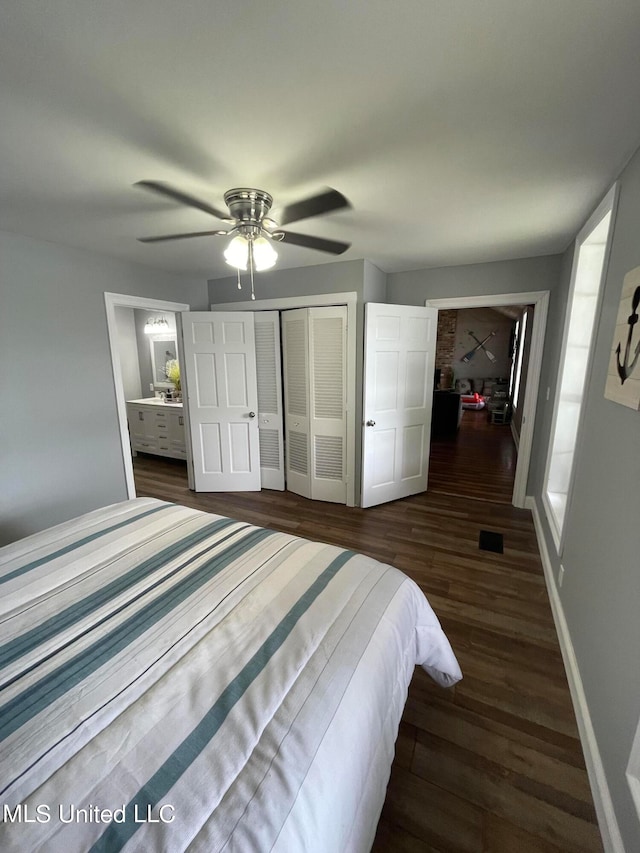 bedroom featuring dark hardwood / wood-style flooring, a closet, and ceiling fan