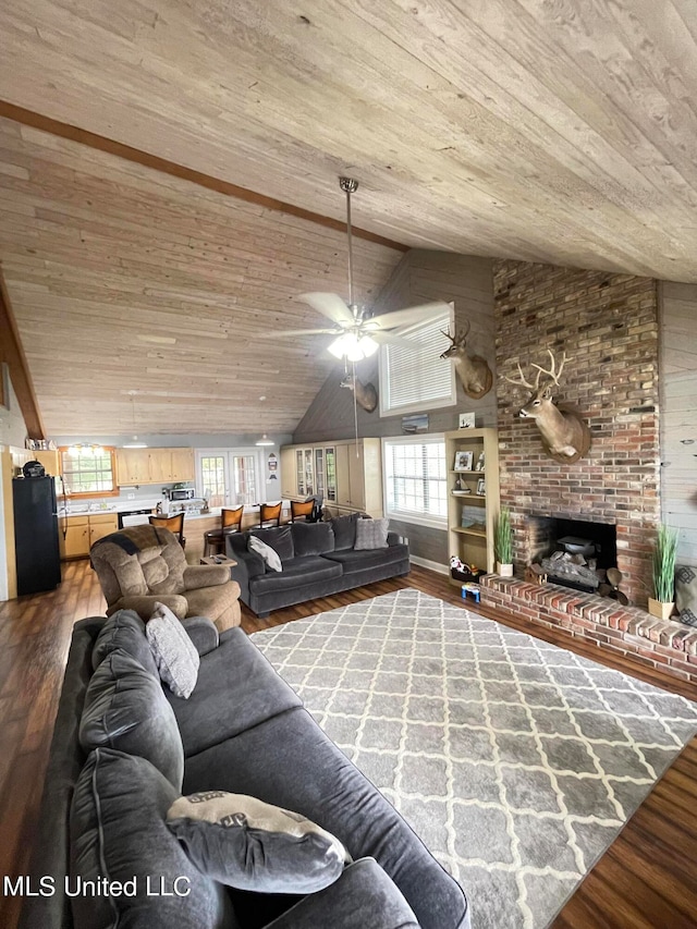 unfurnished living room with lofted ceiling, hardwood / wood-style floors, ceiling fan, wooden ceiling, and a brick fireplace