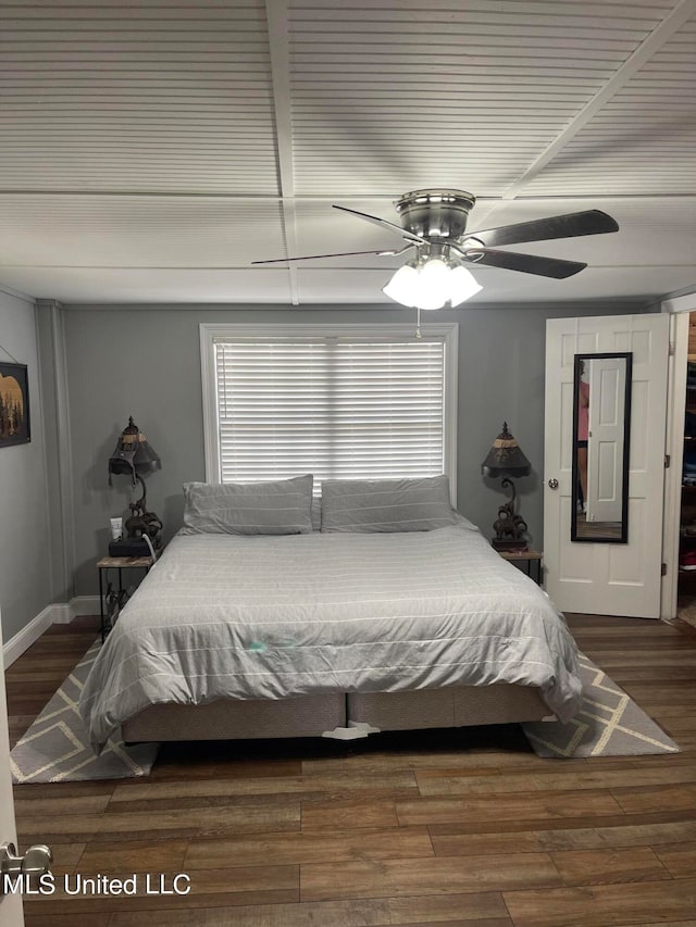 bedroom with hardwood / wood-style floors and ceiling fan