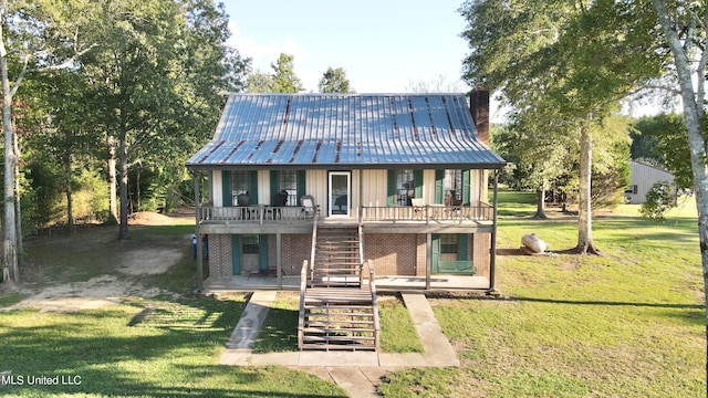 back of house featuring a yard