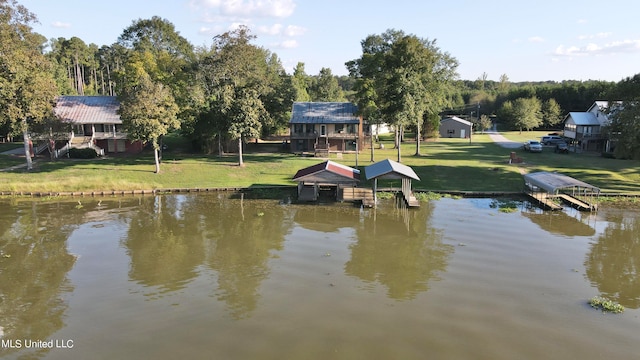 dock area with a yard and a water view