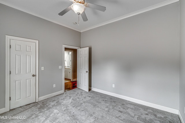 unfurnished bedroom featuring light carpet, ornamental molding, and ceiling fan