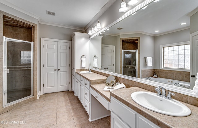 bathroom with ornamental molding, vanity, plus walk in shower, and tile patterned floors