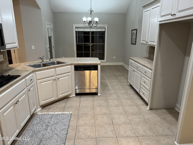 kitchen featuring sink, tile countertops, hanging light fixtures, light tile patterned floors, and dishwasher