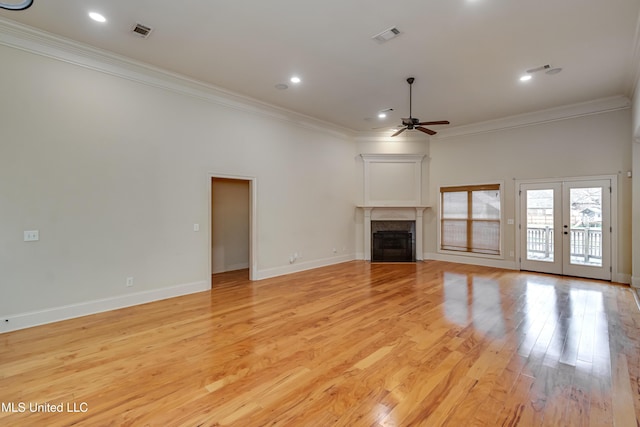 537 Turtle Ln, Brandon, MS 39047 - unfurnished living room with a ceiling fan, crown molding, light wood-type flooring, a fireplace with flush hearth, and baseboards