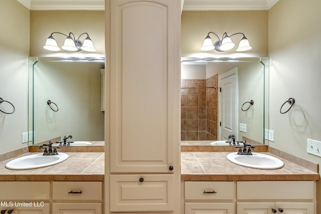 bathroom featuring crown molding and vanity