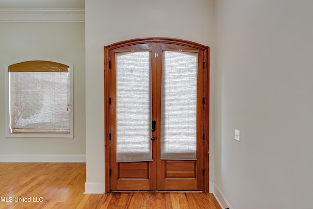 537 Turtle Ln, Brandon, MS 39047 - foyer featuring french doors, light wood finished floors, baseboards, and crown molding