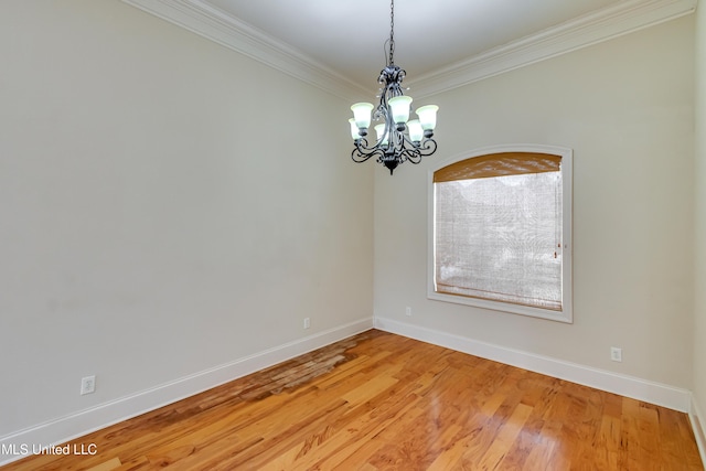 537 Turtle Ln, Brandon, MS 39047 - spare room with ornamental molding, a chandelier, baseboards, and light wood-style flooring