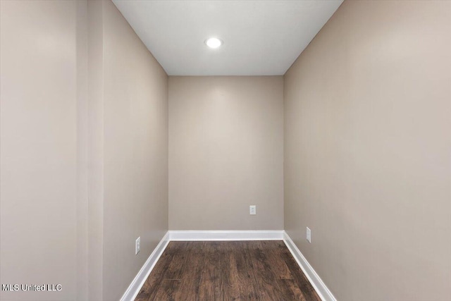 spare room with dark hardwood / wood-style flooring