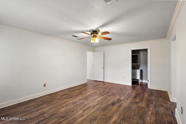 spare room with dark wood-type flooring, crown molding, a textured ceiling, and ceiling fan