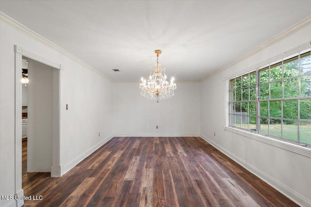 spare room with crown molding, a chandelier, and dark hardwood / wood-style flooring