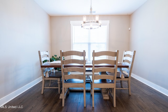 dining area with a chandelier and dark hardwood / wood-style floors