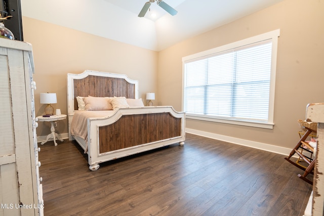 bedroom featuring ceiling fan, vaulted ceiling, and dark hardwood / wood-style flooring