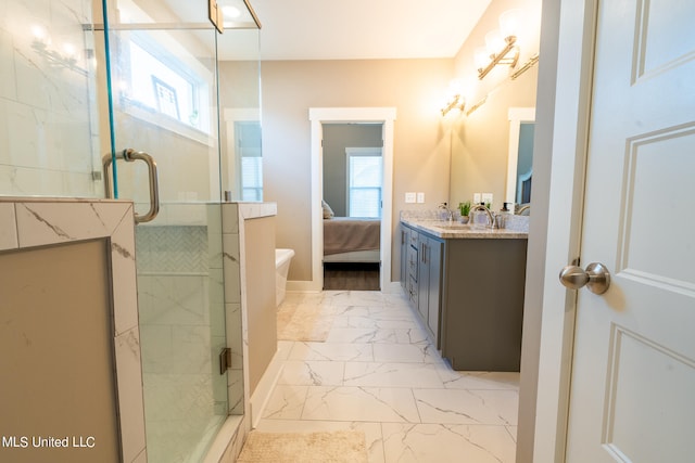 bathroom with vanity and a shower with shower door