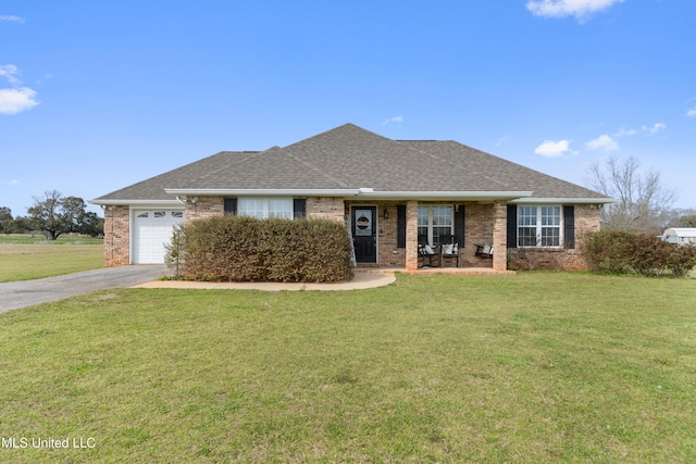 ranch-style house with a front lawn, brick siding, driveway, and a shingled roof