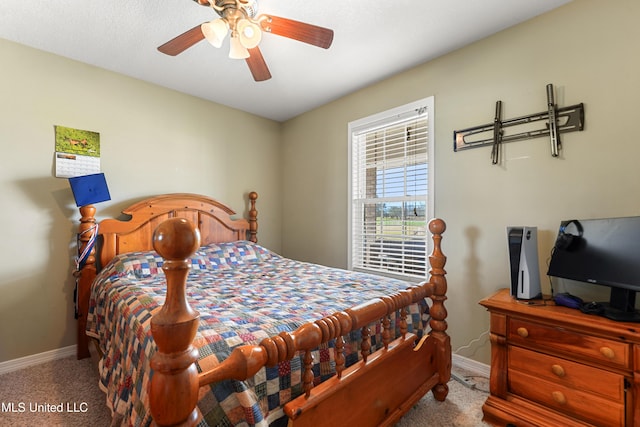 carpeted bedroom with baseboards and ceiling fan