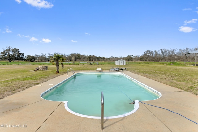 outdoor pool featuring an outbuilding, a lawn, and a shed