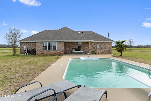 pool with a lawn, central AC unit, and a patio area