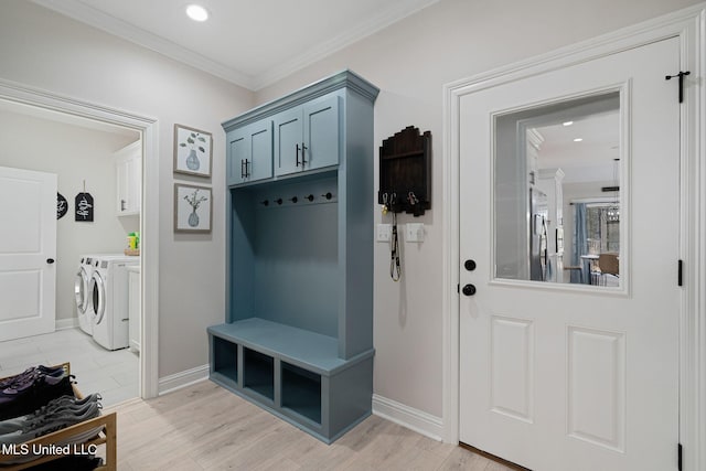 mudroom with crown molding, washer and dryer, and light wood-type flooring