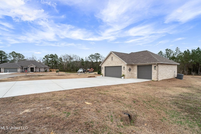 exterior space with a garage and a front lawn