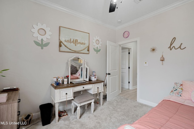 carpeted bedroom with crown molding and ceiling fan