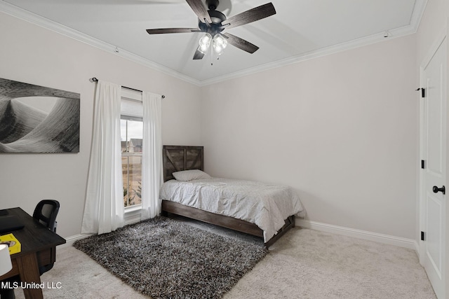 carpeted bedroom with ceiling fan and ornamental molding