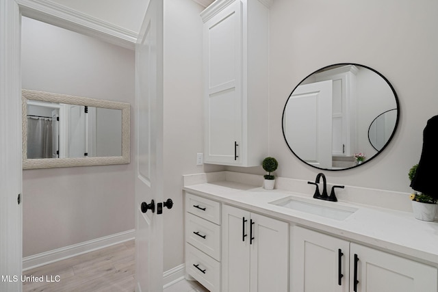 bathroom with vanity and wood-type flooring