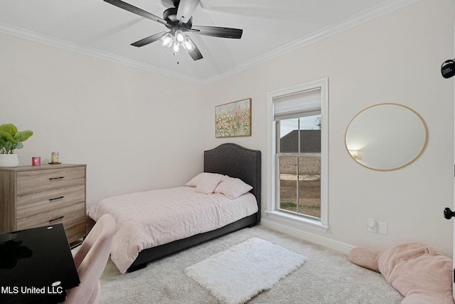 carpeted bedroom featuring ceiling fan and ornamental molding