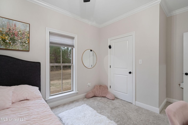 carpeted bedroom featuring crown molding