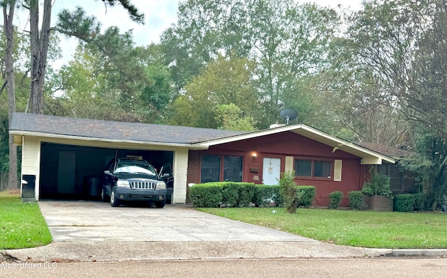 single story home with a garage and a front yard