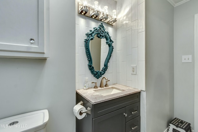 bathroom featuring vanity and toilet