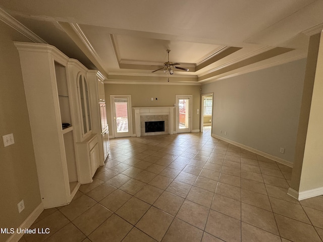 314 Fox Holw, Canton, MS 39046 - unfurnished living room featuring a ceiling fan, a raised ceiling, baseboards, ornamental molding, and light tile patterned flooring