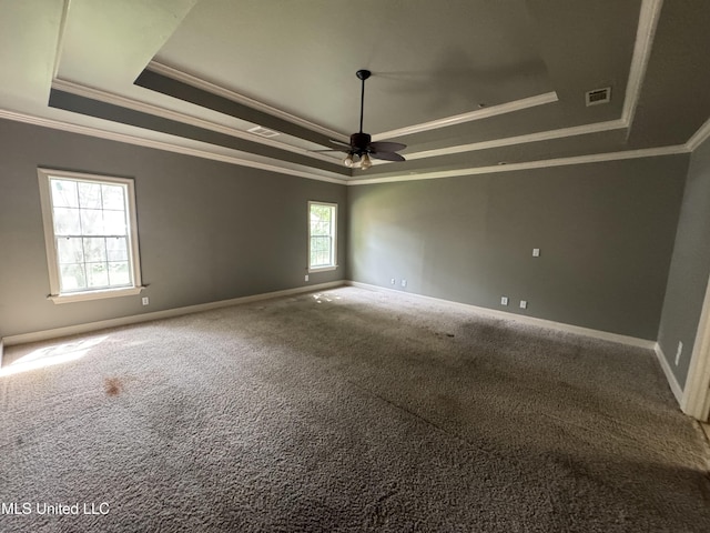 314 Fox Holw, Canton, MS 39046 - empty room featuring a tray ceiling, crown molding, carpet floors, baseboards, and a ceiling fan